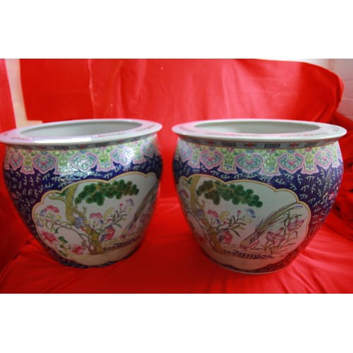 111 - Two large Chinese Famille Planter Koi fish bowls approx 24 inches tall by 24 across.