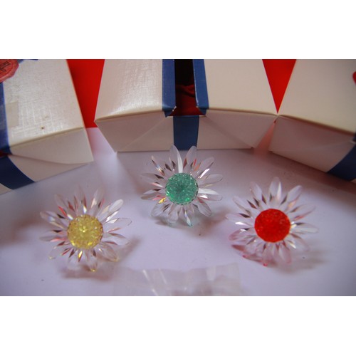 118 - A set of 3 Swarovski Crystal Marguerite Daisies, yellow, blue and red