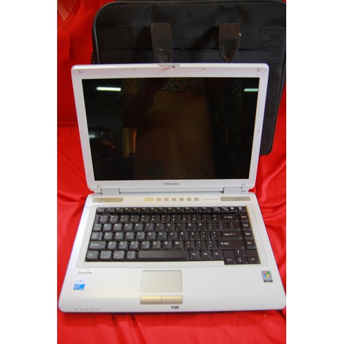 201 - A Toshiba Satellite laptop with charger in bag, in good working order and very clean condition, not ... 