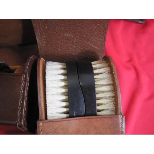 161 - 7 leather items consisting of 4 empty cases and three with contents: shoe polish, hair brushes and b... 