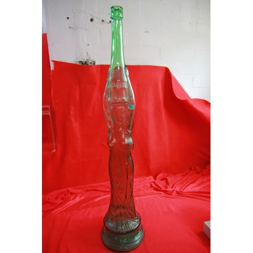 76 - Large glass Chianti bottle in the form of a woman