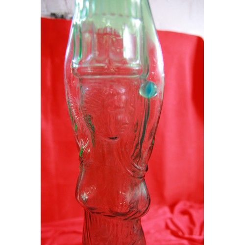 76 - Large glass Chianti bottle in the form of a woman