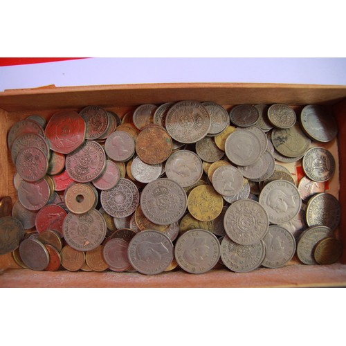 114 - A vintage cigar box containing mixed coinage including a 1943 Vichy 2 franc and others.