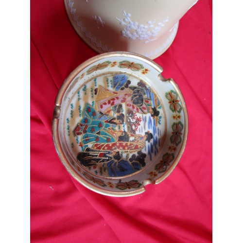 60 - A selection of Pottery items from both UK and Japan to include three Japanese ashtrays a Wedgwood pl... 