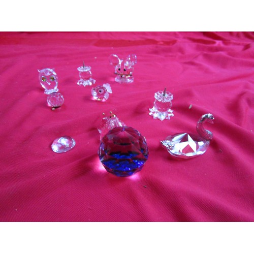 93 - A collection of Swarovski Crystal to include a mini candle sticks an Owl,Pig,Fish,Tortoise,Butterfly... 