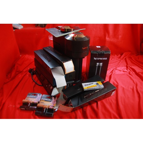 218 - A Nespresso coffee machine with a quantity of pods and a new foamer attachment