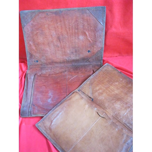 210 - A pair of antique leather writing pouches in good order, nicely worn
