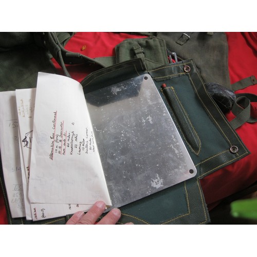 184 - A military framed rucksack full of various items of webbing including 58 pattern pistol holster and ... 