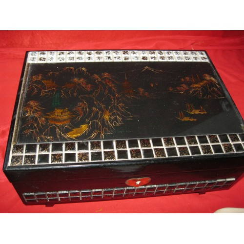 170C - A vintage Oriental style inlaid musical jewellery box full of costume jewellery but including a 9ct ... 
