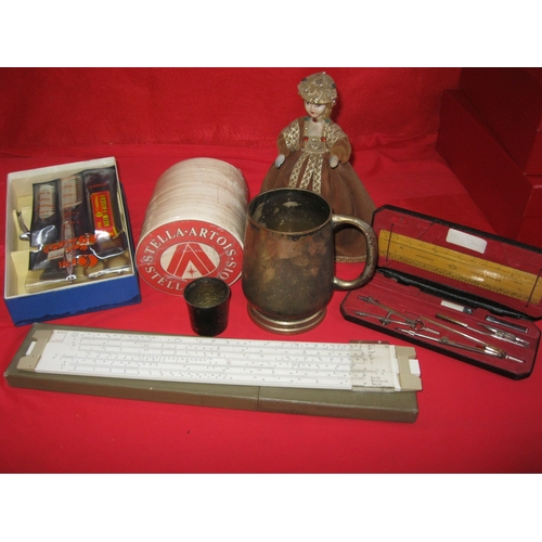 215A - A mixed lot comprising pewter, a porcelain-faced antique doll, slide rule, Helix geometry set and ot... 