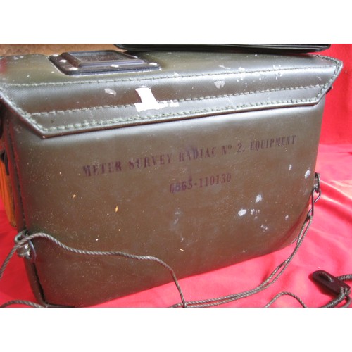 190 - A vintage military Geiger counter, in original box with original carry case and unused strap