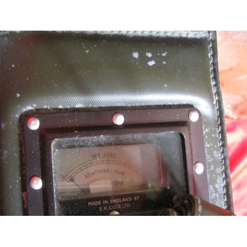 190 - A vintage military Geiger counter, in original box with original carry case and unused strap