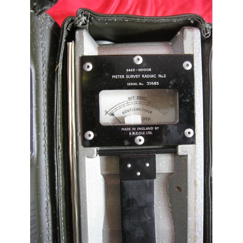 190 - A vintage military Geiger counter, in original box with original carry case and unused strap