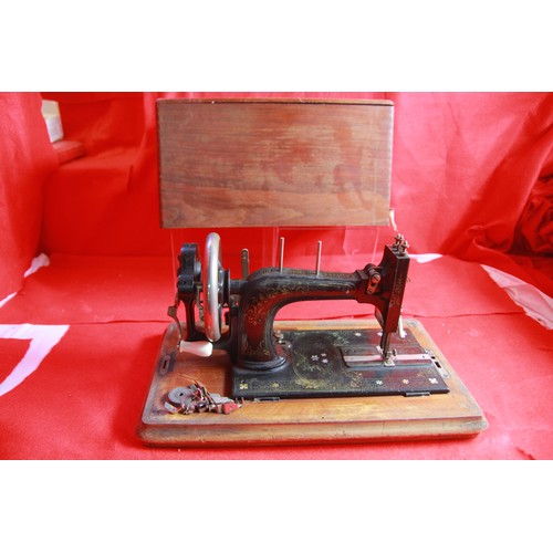 170 - Antique Frister & Rossman handwind sewing machine (#12784-1876-1880), embossed  with mother-of-pearl... 