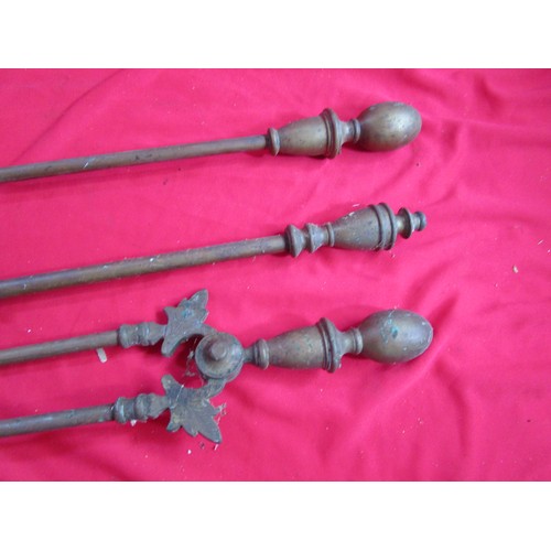 247 - A vintage companion set in heavy brass Tongs Poker and shovel.