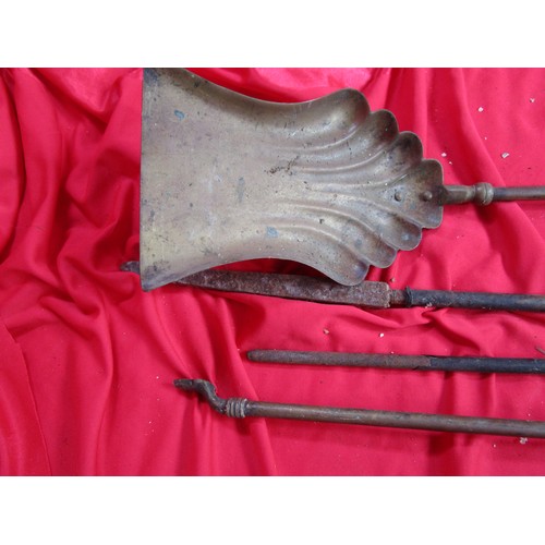 247 - A vintage companion set in heavy brass Tongs Poker and shovel.