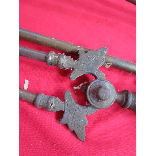 247 - A vintage companion set in heavy brass Tongs Poker and shovel.