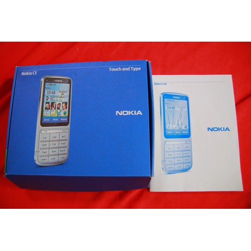 188 - A Nokia C3-01 Mobile Phone, boxed, with instructions, charger and headphones