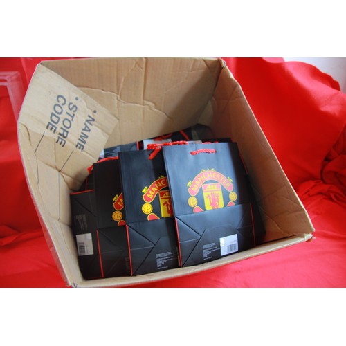 284 - Quantity of small, black Manchester United gift bags
