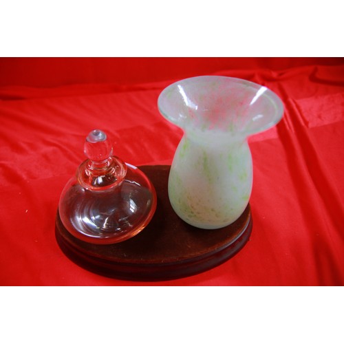 292 - A peach coloured scent bottle with stopper and a green art glass vase, both in good order