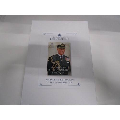 308 - A unopened Charles 3rd 300 piece jigsaw mint unopened in it's plastic bag and box .
Completed puzzle... 