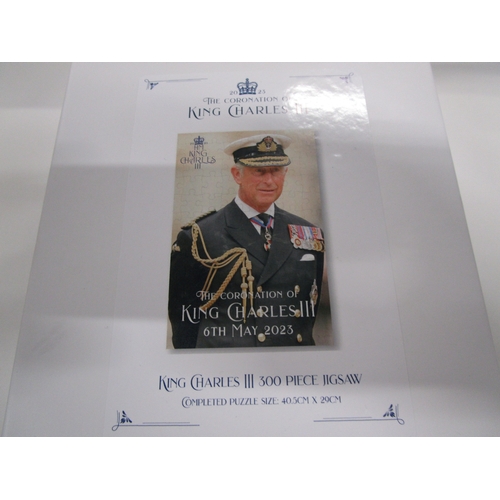 308 - A unopened Charles 3rd 300 piece jigsaw mint unopened in it's plastic bag and box .
Completed puzzle... 