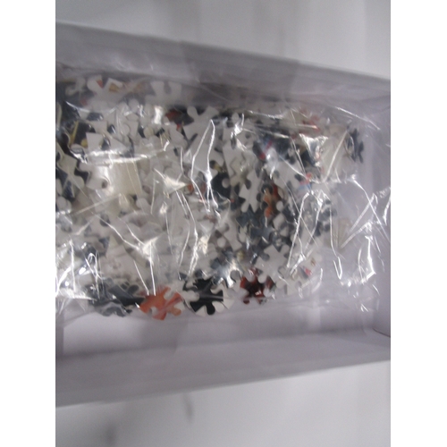 308 - A unopened Charles 3rd 300 piece jigsaw mint unopened in it's plastic bag and box .
Completed puzzle... 