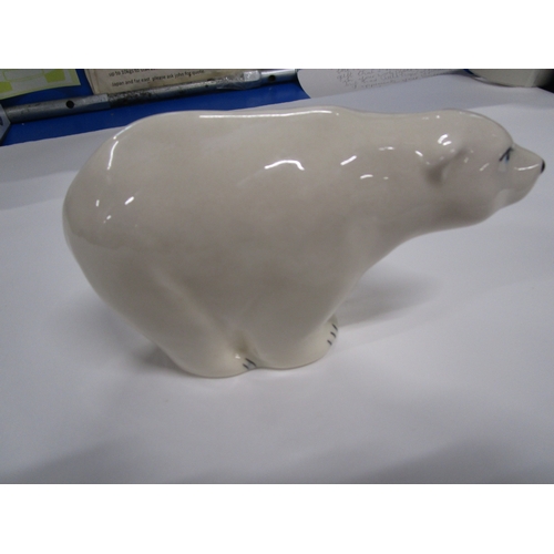 309 - A Babacombe Pottery Hand painted Polar Bear approx six inches long by four tall in pristine conditio... 
