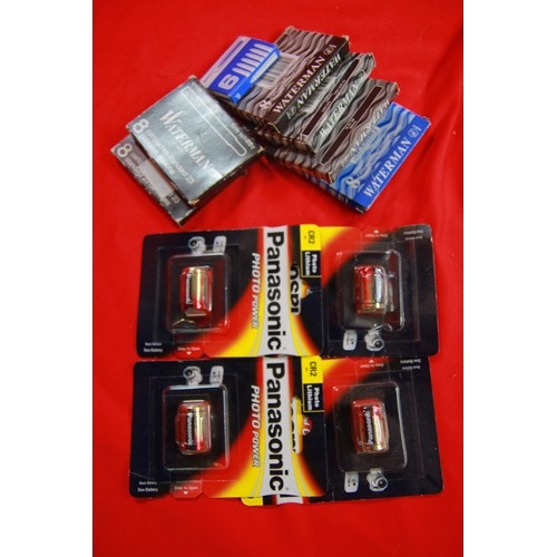 302 - A tub containing 4 sealed Panasonic CR2 batteries and a small quantity of ink pen cartridges in orig... 