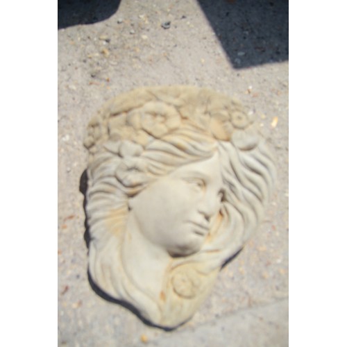 325 - A cast garden wall pocket featuring a woman