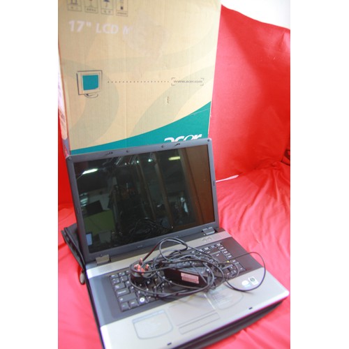 338 - A laptop computer and a computer monitor, the latter boxed