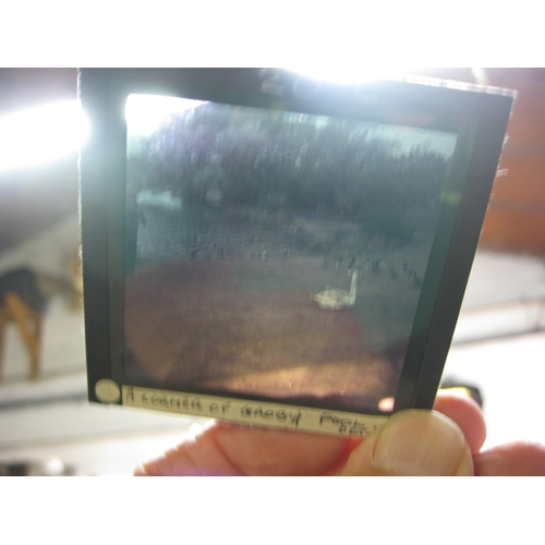 404 - A wooden Johnson 'Sixty Six' slide box containing late 1950s glass slides, full, 100 capacity