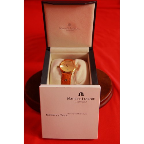 242 - A Maurice La Croix 18 carat gold watch, absolutely immaculate, with inner and outer box, all papers,... 