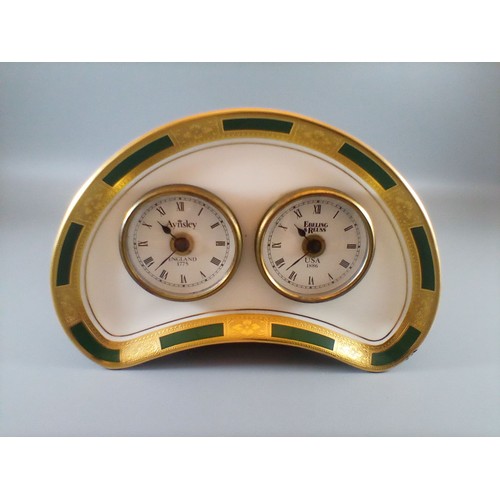250A - A selection of 3 clocks comprising a rare 1988 Aynsley Commemorative Clock, a solid brass Rapport of... 