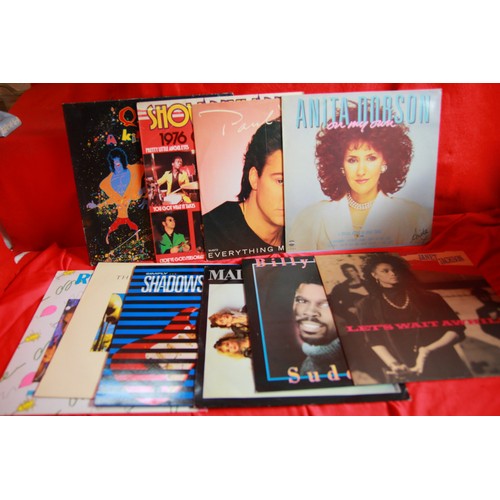 103 - A box of mainly 1980s LPs including Queen, Genesis and many others, plus a small selection of single... 