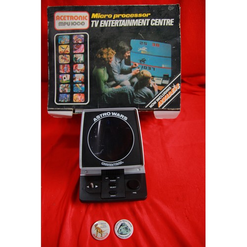 101 - A vintage Grandstand Astro Wars hand-held video game and a vintage Acetronic MPU1000 video games sys... 