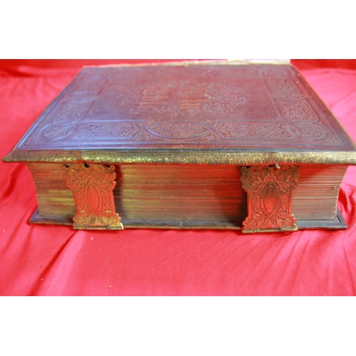 195 - A pair of large antique leather bound bibles