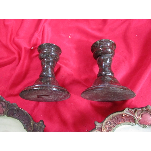 211 - Two marble Candlesticks along with two ceramic plates in relief which appear to be of European vinta... 