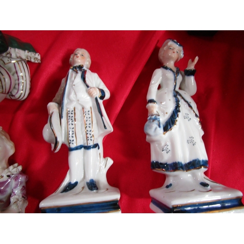 212 - A selection of Foreign and CT ceramics figurines along with a couple of other figurines and a porcel... 