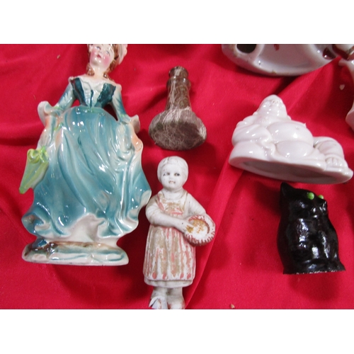 212 - A selection of Foreign and CT ceramics figurines along with a couple of other figurines and a porcel... 