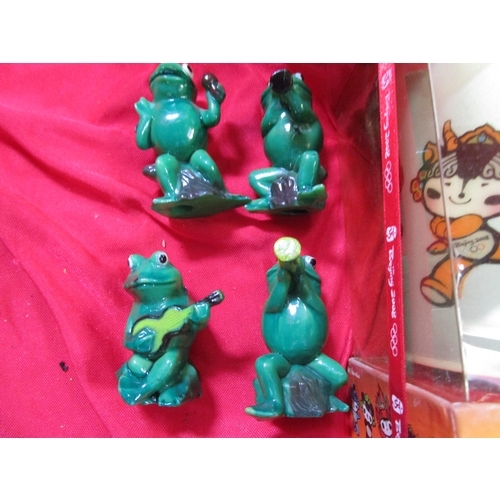 215 - 2008 Olympic mug fully boxed with original carry bag, along with four green plastic frogs who appear... 