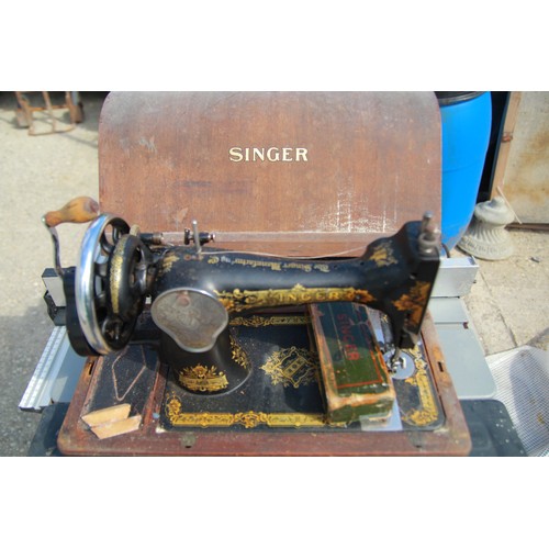 220 - A vintage Singer sewing machine in case