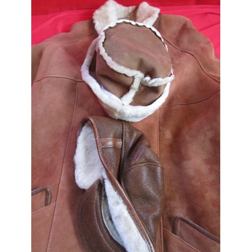 223 - A sheepskin car coat, ladies, in unworn condition, and two matching lined hats