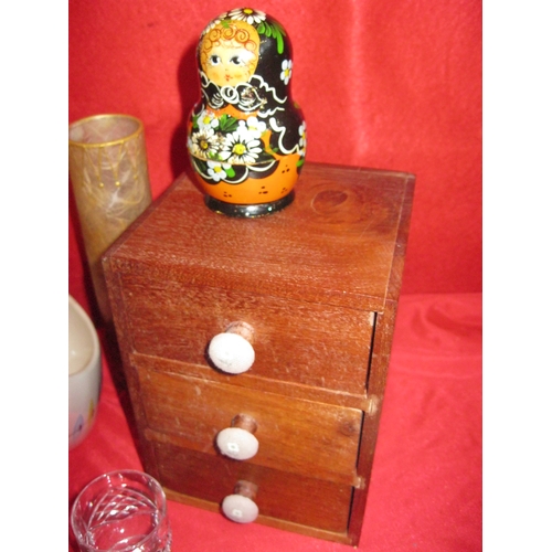 247 - An interesting assortment of items including a small treen desktop cabinet, treen and glass candlest... 