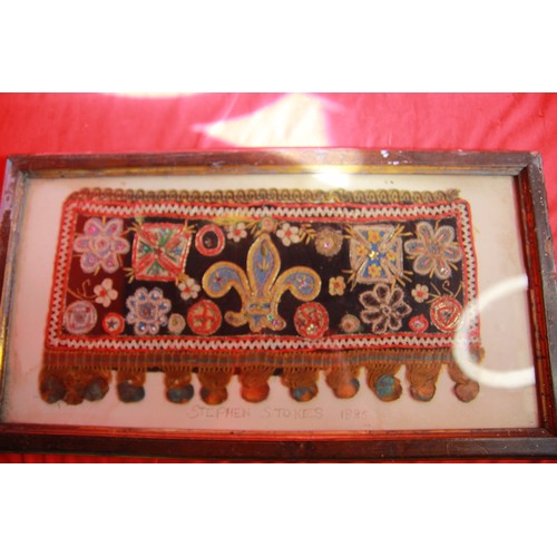 280 - An antique embroidered strip, framed and glazed, featuring a Fleur du Lys and various crosses, named... 