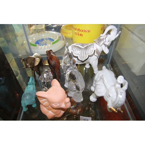 318 - Eight Elephants including a Lenox Glass version and a Lenox Porcelain version along with six other v... 