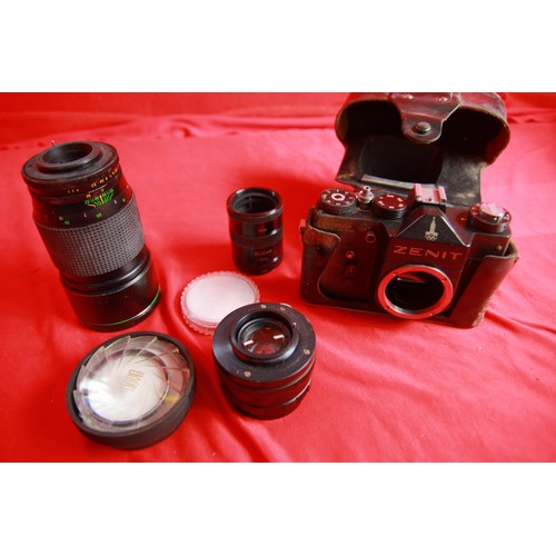 353 - A 1980 Moscow Olympics model Zenit EM 35mm SLR Camera in case, with original Helios lens and another... 