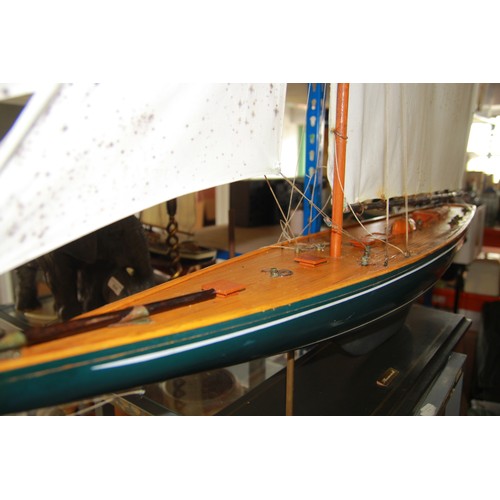 309 - A very large model of the sailing yacht Shamrock on stand, in good overall condition, 55