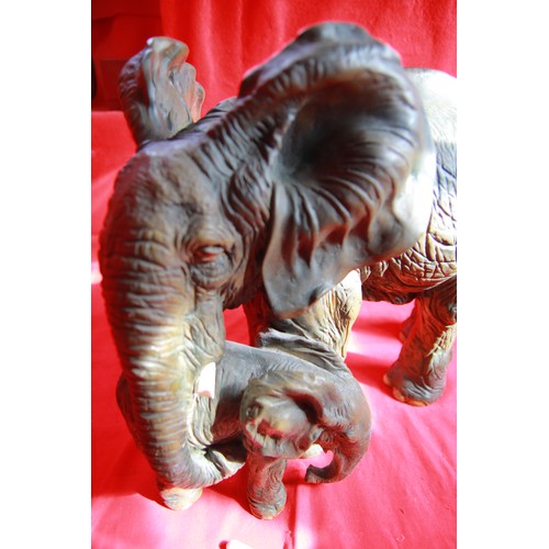 334 - A large resin Elephant and Calf .
Picture shows tusks have been broken off but are ready to refix