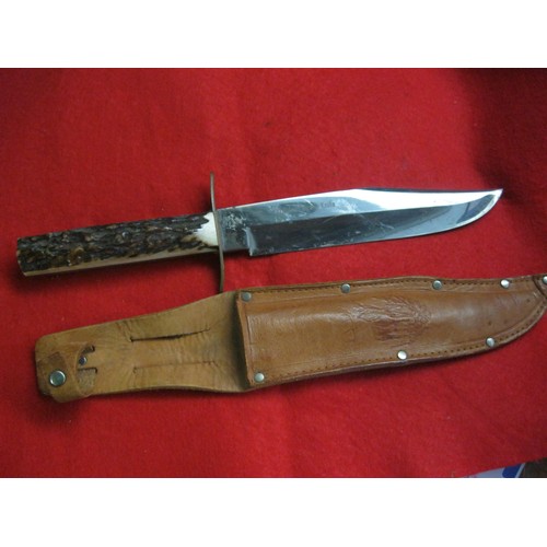 173 - An Original Bowie Knife by Whitby of Solingen Steel, with bone handle and leather scabbard, 8